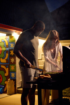 Friends are hosting a barbecue in the evening