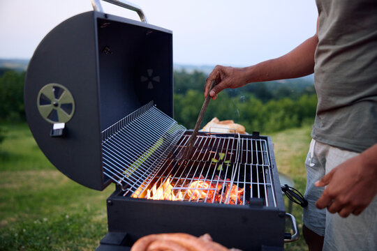 Man prepares a barbecue