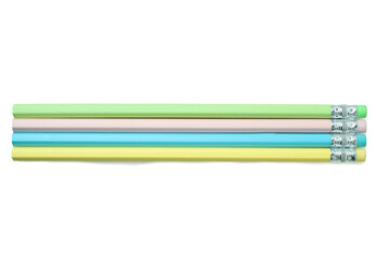 Row of unsharpened colorful wooden pencils isolated over a white background. Concept of stationery