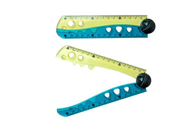 Closeup view of folded ruler isolated over a white background. Concept of stationery