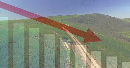 Showing red arrow indicating downward trend across fields with dirt road and bar chart