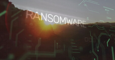 Floating bold RANSOMWARE text hovering over mountain peaks at sunset, with green and white circuits