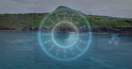 Displaying AR overlaying conical hill at ocean shore, with HUD reticle, arrow markers, code panels