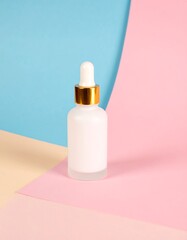 Elegant serum bottle on pastel background for skincare and beauty product presentation with modern design
