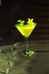green cocktail with lime