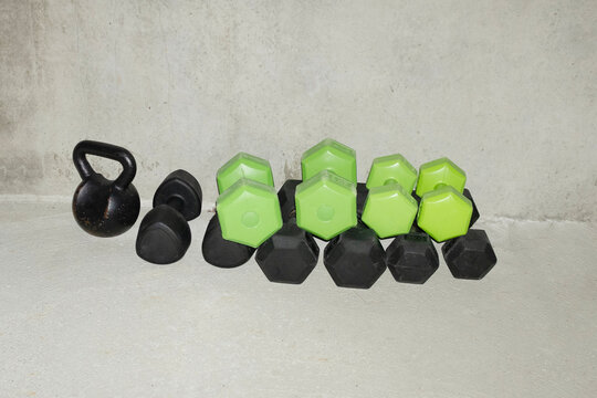 Heavy working out sport gym lifting weights dumbbells with flashlight