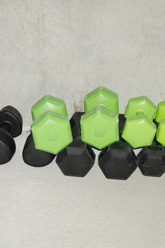 Heavy working out sport gym lifting weights dumbbells with flashlight