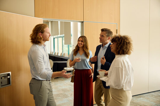 Businesspeople chat at the conference