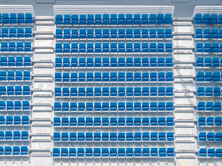 Organized Stadium Seating with Blue Chairs