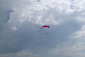Man paragliding in the town of Organya in the province of Lleida in northern Spain in August 2025.