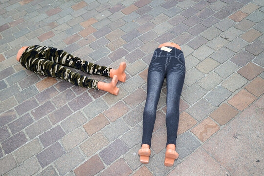 Mannequin legs on the ground wearing in jeans