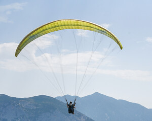 Man paragliding in the town of Organya in the province of Lleida in northern Spain in August 2025.