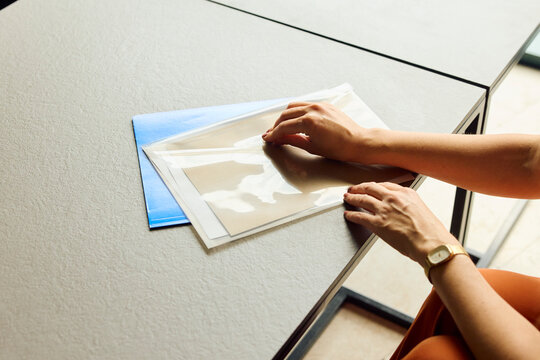 Businesswoman seals the document case.