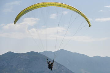 Man paragliding in the town of Organya in the province of Lleida in northern Spain in August 2025.