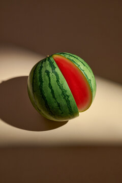 A halved watermelon showcases its vibrant red flesh