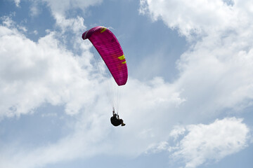 Man paragliding in the town of Organya in the province of Lleida in northern Spain in August 2025.