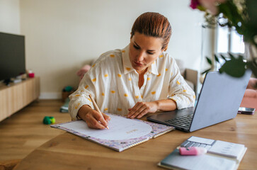 Woman Planning On Calendar
