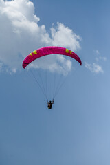 Man paragliding in the town of Organya in the province of Lleida in northern Spain in August 2025.
