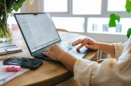 Hands Typing On Laptop