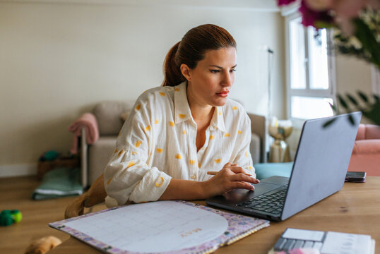 Woman Focused On Laptop