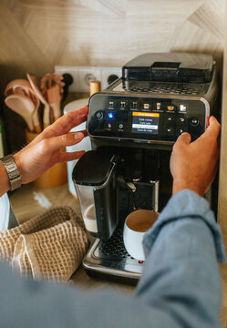 Man Using Modern Coffee Machine Indoors
