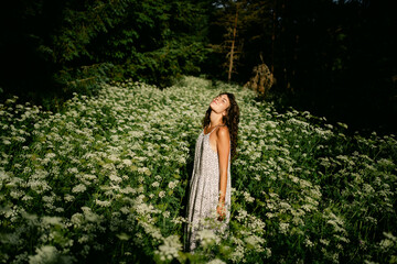 young woman in a field of wild flowers 