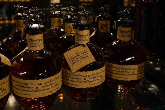 Frankfort, Kentucky, USA, July 10, 2025
Buffalo Trace Distillery. Bottles of Blanton's Bourbon Whiskey sitting on a shelf. Horse statute on top of bottles.