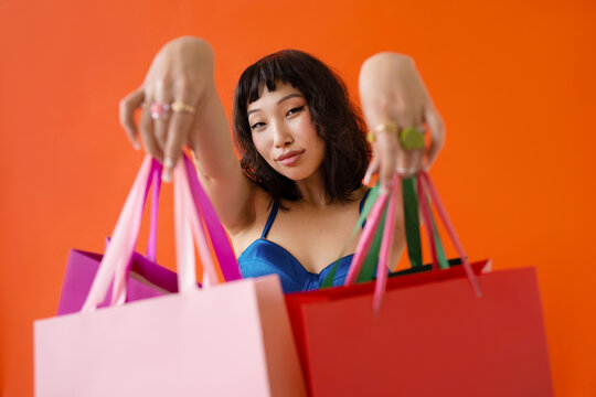 Asian beautiful happy young woman with shopping bags