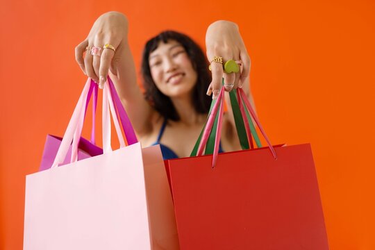 Asian beautiful happy young woman with shopping bags