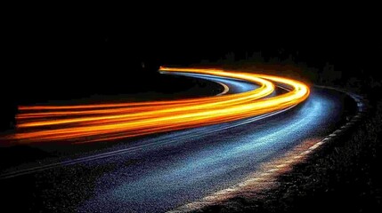 Light trails on a dark road suggest motion and speed.