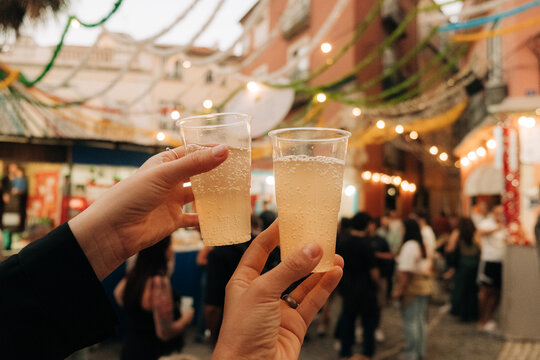 Toasting with drinks at Santo Antonio street festival