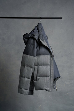 Warm and stylish jacket displayed on a minimalist hanger