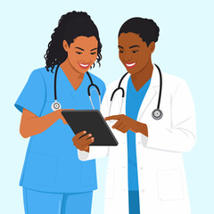 Fototapeta premium Two smiling Black female medical professionals, a doctor and a nurse, collaborating over a digital tablet.