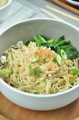 Chicken noodles with vegetables, an Indonesian delicious popular food called mie ayam
