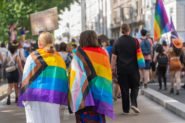 Couple Wrapped In Pride Flags