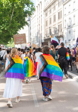 Marchers Wrapped In Pride Flags