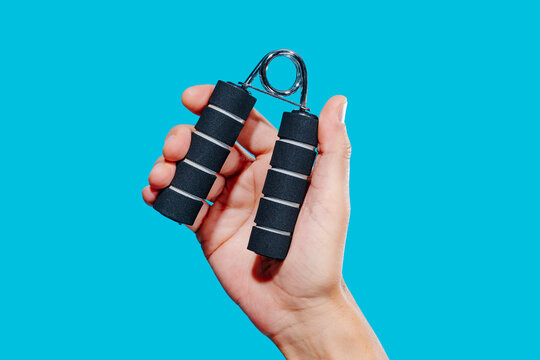 close-up of a man using a hand gripper