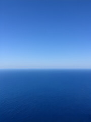 Fototapeta premium Endless Horizon: The vast expanse of open ocean, meeting the distant skyline.
