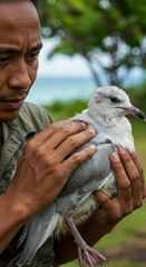 Conservationist Holding Seabird