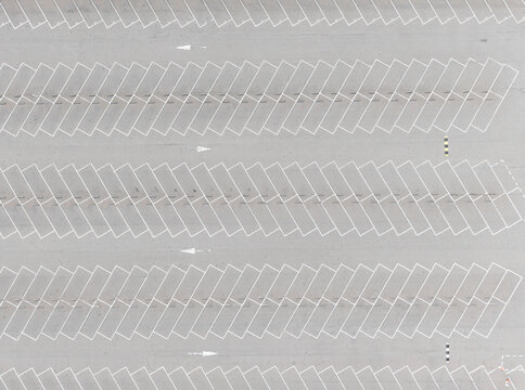 Aerial view of empty parking lot spaces