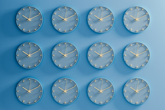 Unique collection of clocks displaying different times on a blue wall