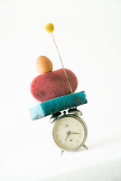 Unique arrangement of everyday objects on an alarm clock