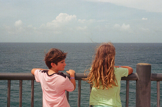 Children Looking Out Over Ocean in Puerto Rico
