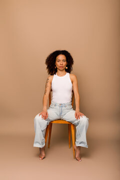 roan sitting against beige backdrop