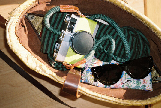 Summer Essentials in Woven Beach Bag with film Camera
