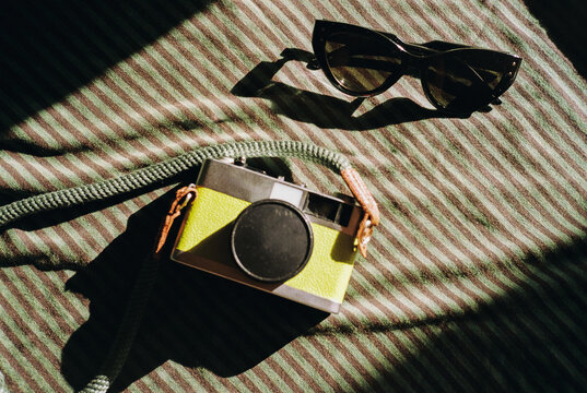 Retro Film Camera and Sunglasses. Summer vacation concept