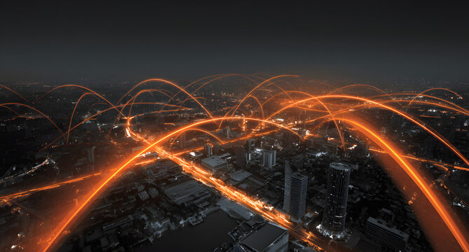 Aerial view of a city at night with bright orange lines resembling a network connection overlayed