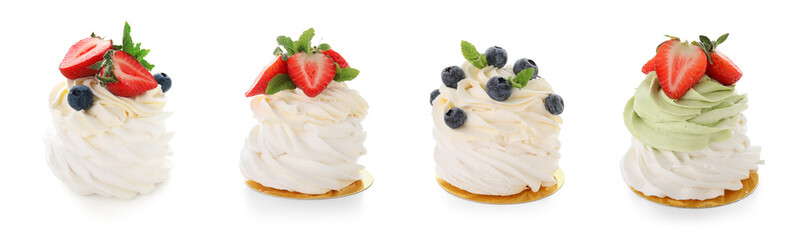 Set of sweet Pavlova cakes with fresh berries on white background