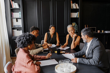 Lawyers team discussing legal case in modern office