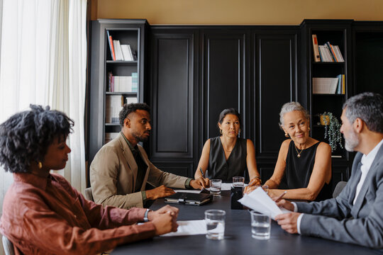 Lawyers having a meeting in the formal office